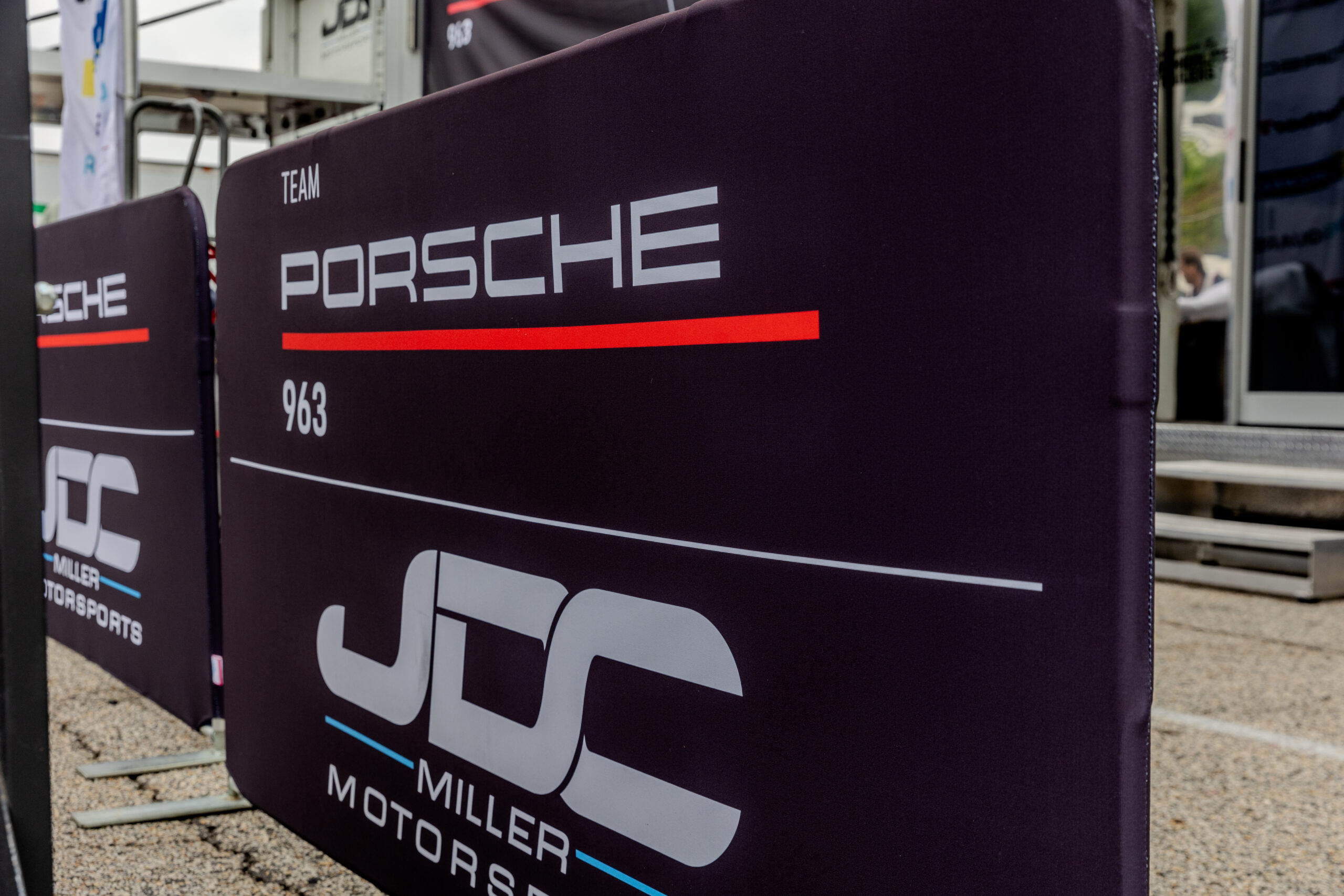 Out There Brands Custom Branded Motorsport JDC porsche crowd barriers